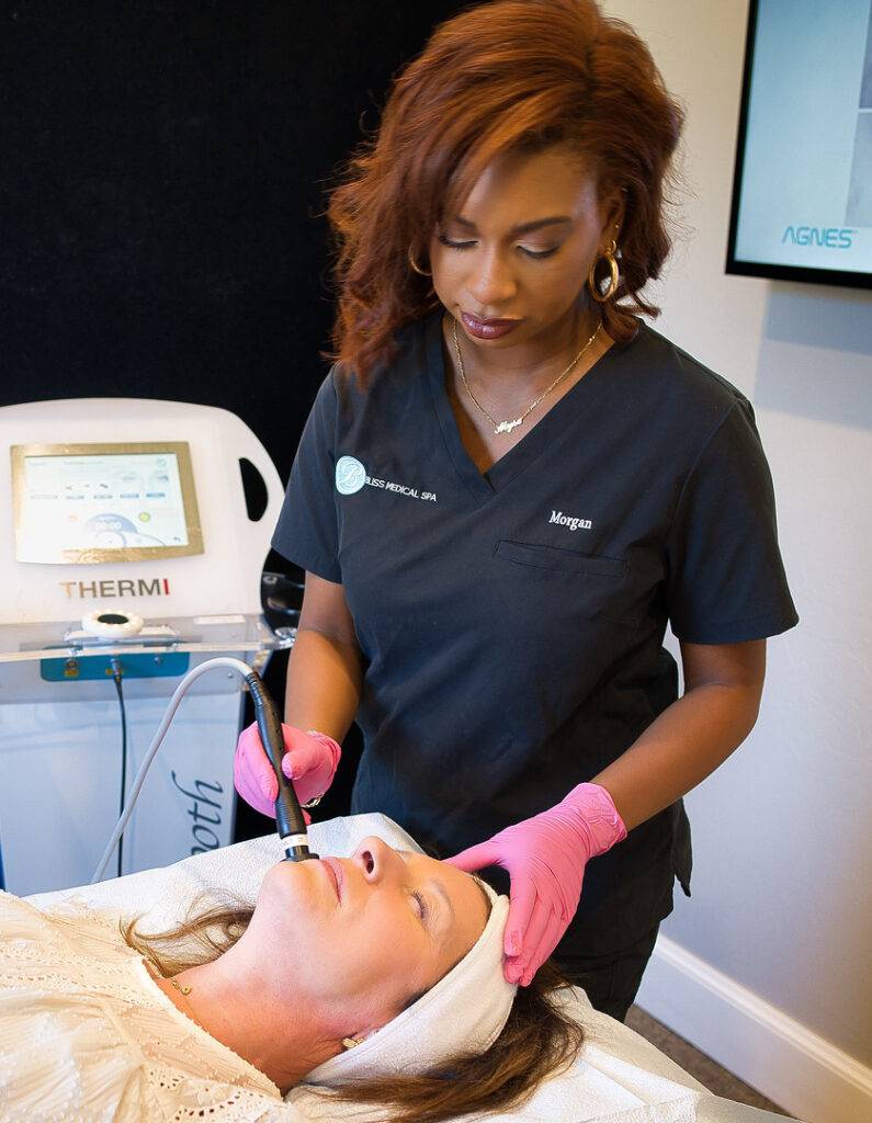 Woman providing a skincare rejuvenation treatment