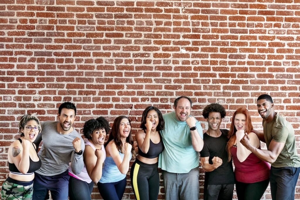 Group of people working out at a gym together as part of a weight loss program that includes semaglutide and tirzepatide near Edmond, OK